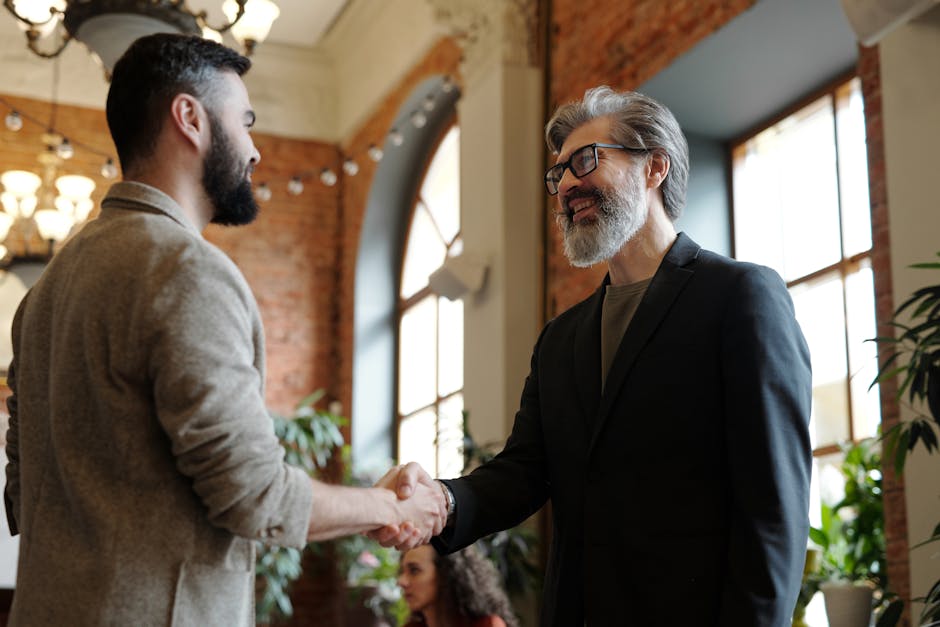 Smiling Businessmen Hand Shaking